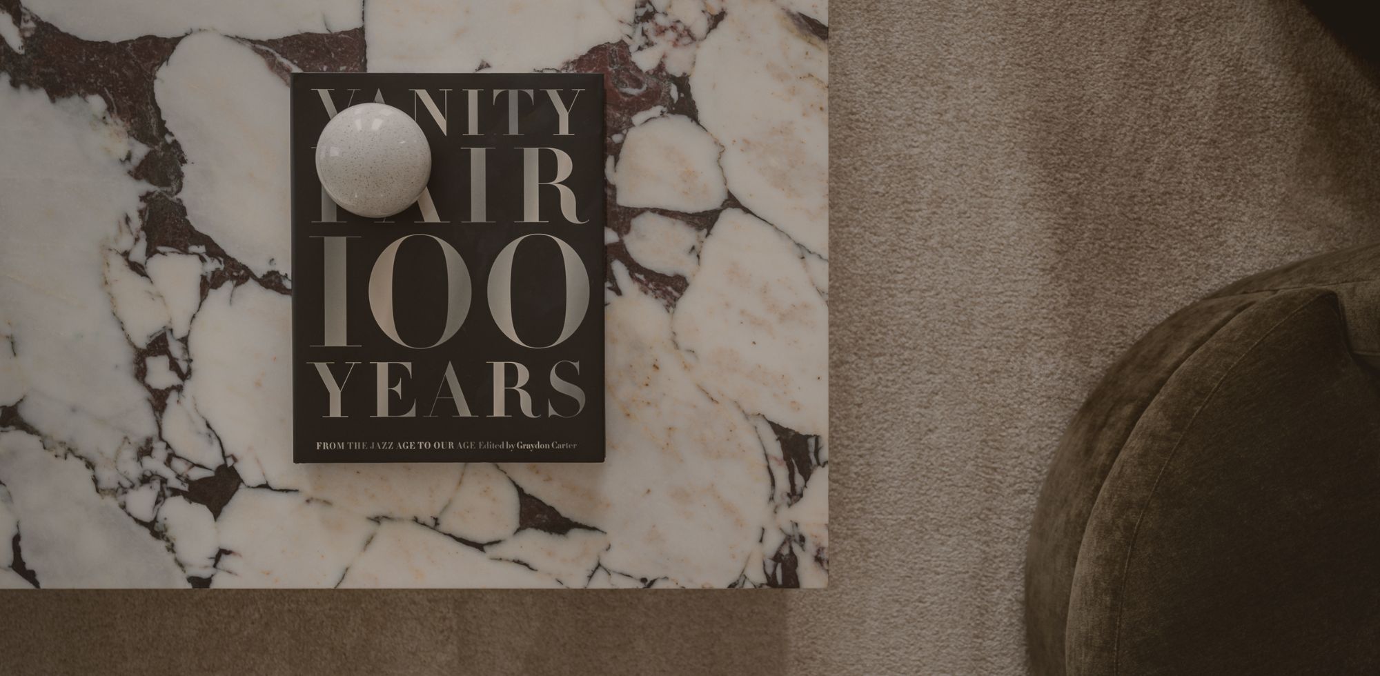 Cover photo for Maison Juniper About page. Photo of calacatta viola marble table with vanity fair coffee table book. Interior Design by Olive & Neon.