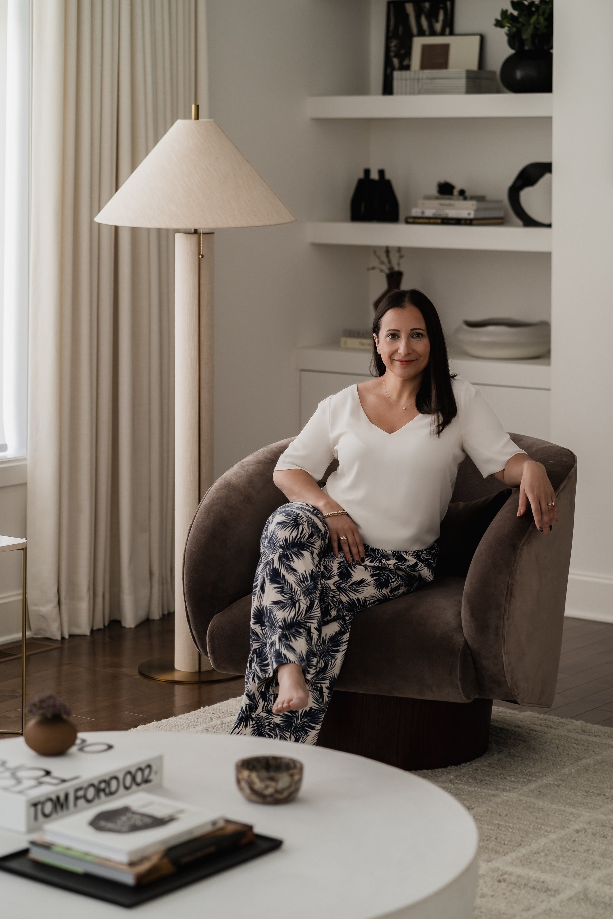 Photo of Melissa Kanfi, interior designer and owner of Olive & Neon and Maison Juniper. Taken in living room of Bois Franc Project in Montreal, Quebec, Canada.